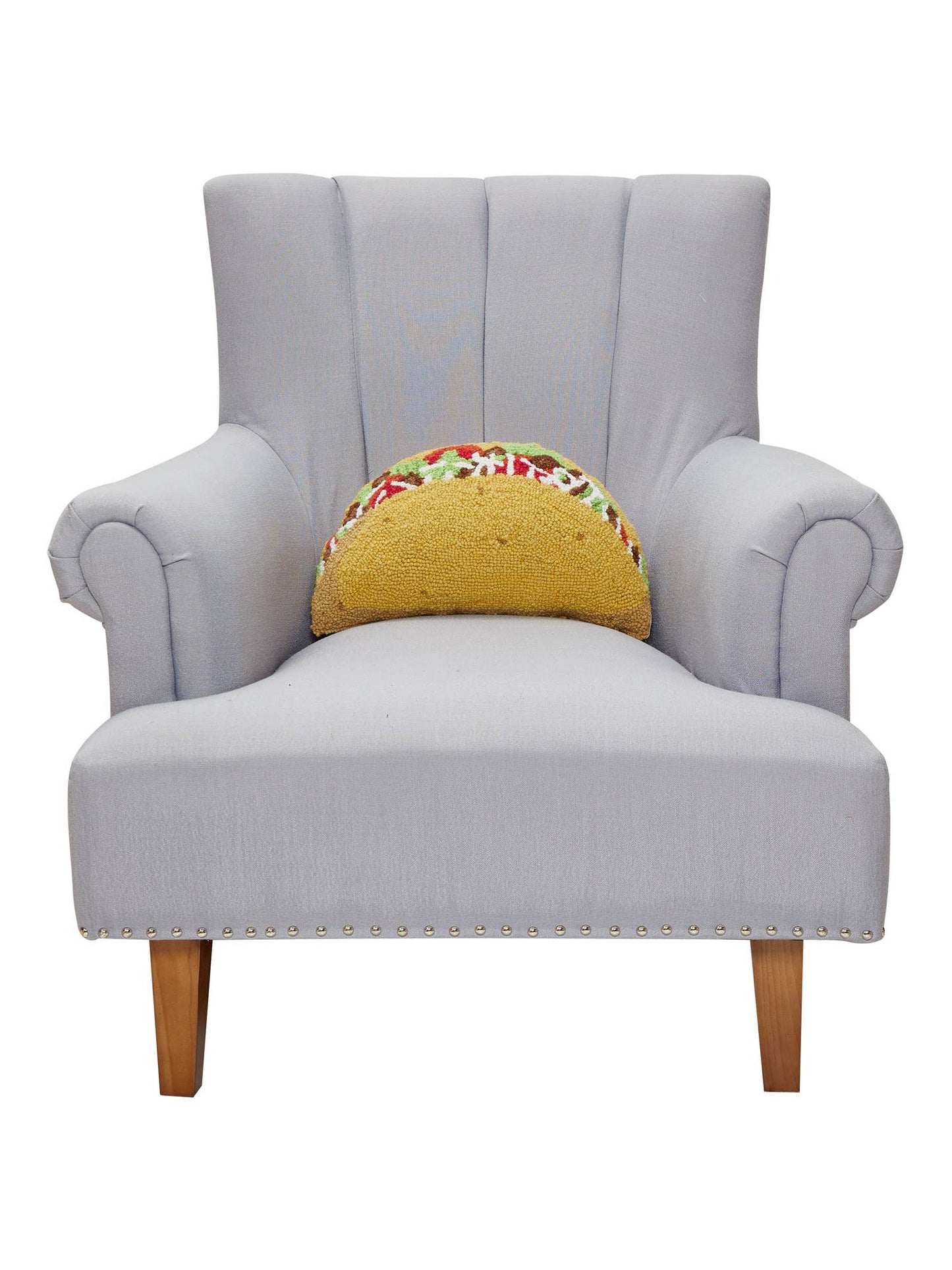 Gray armchair with a colorful taco-shaped cushion on a white background