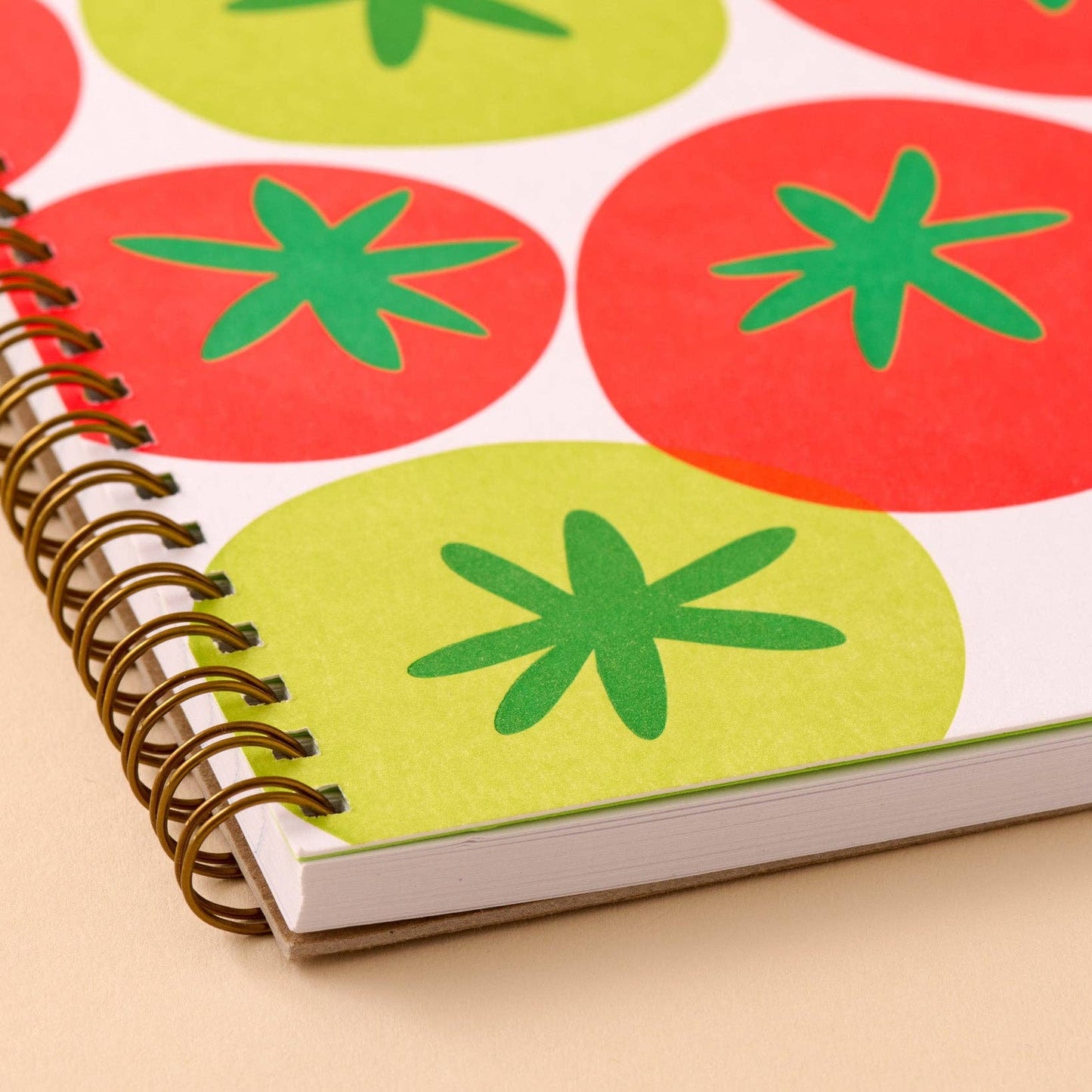 Notebook with tomato pattern on a beige background