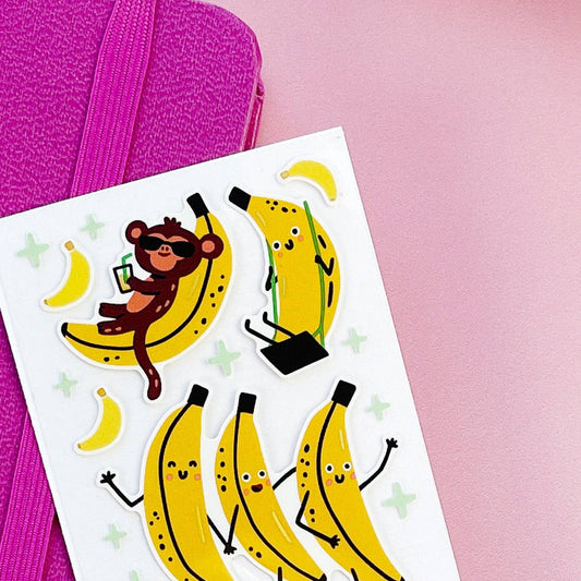 Sheet of banana and monkey stickers on a pink background