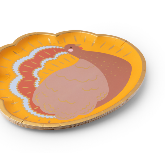 Paper plate with a turkey design on an orange background
