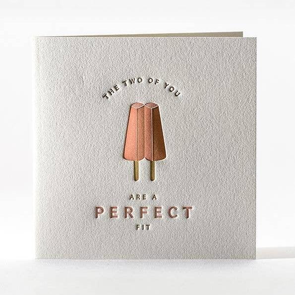 Greeting card with twin strawberry popsicles and text that reads "The two of you are a perfect fit"