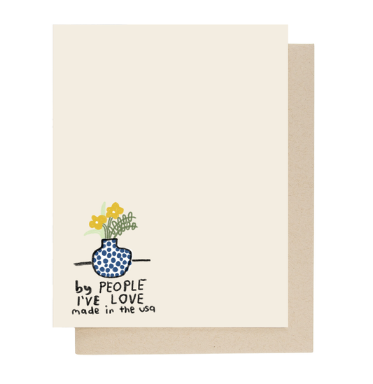 Back of card with a blue vase and flowers illustration and branded text on a white background