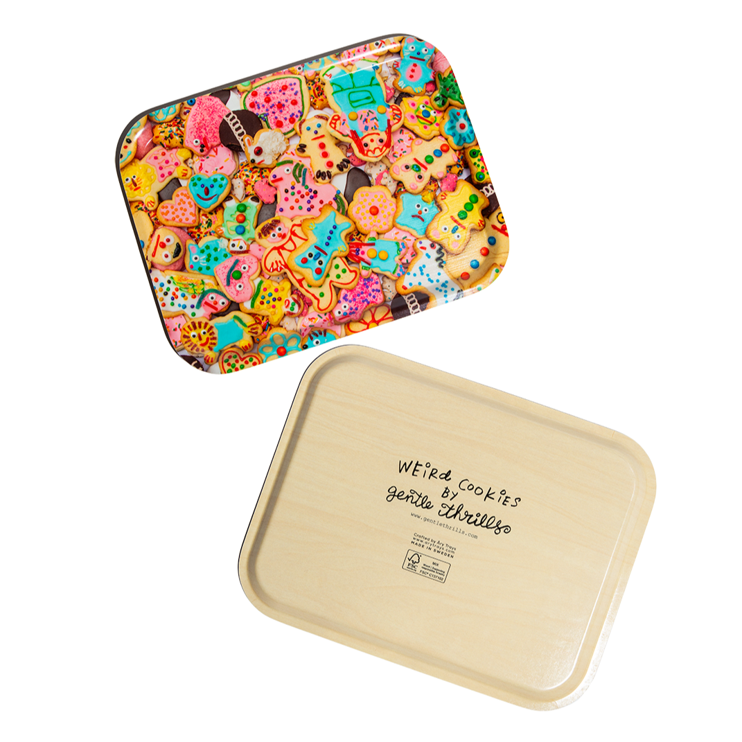 Colorful tray with a pattern of weird cookies on a white background