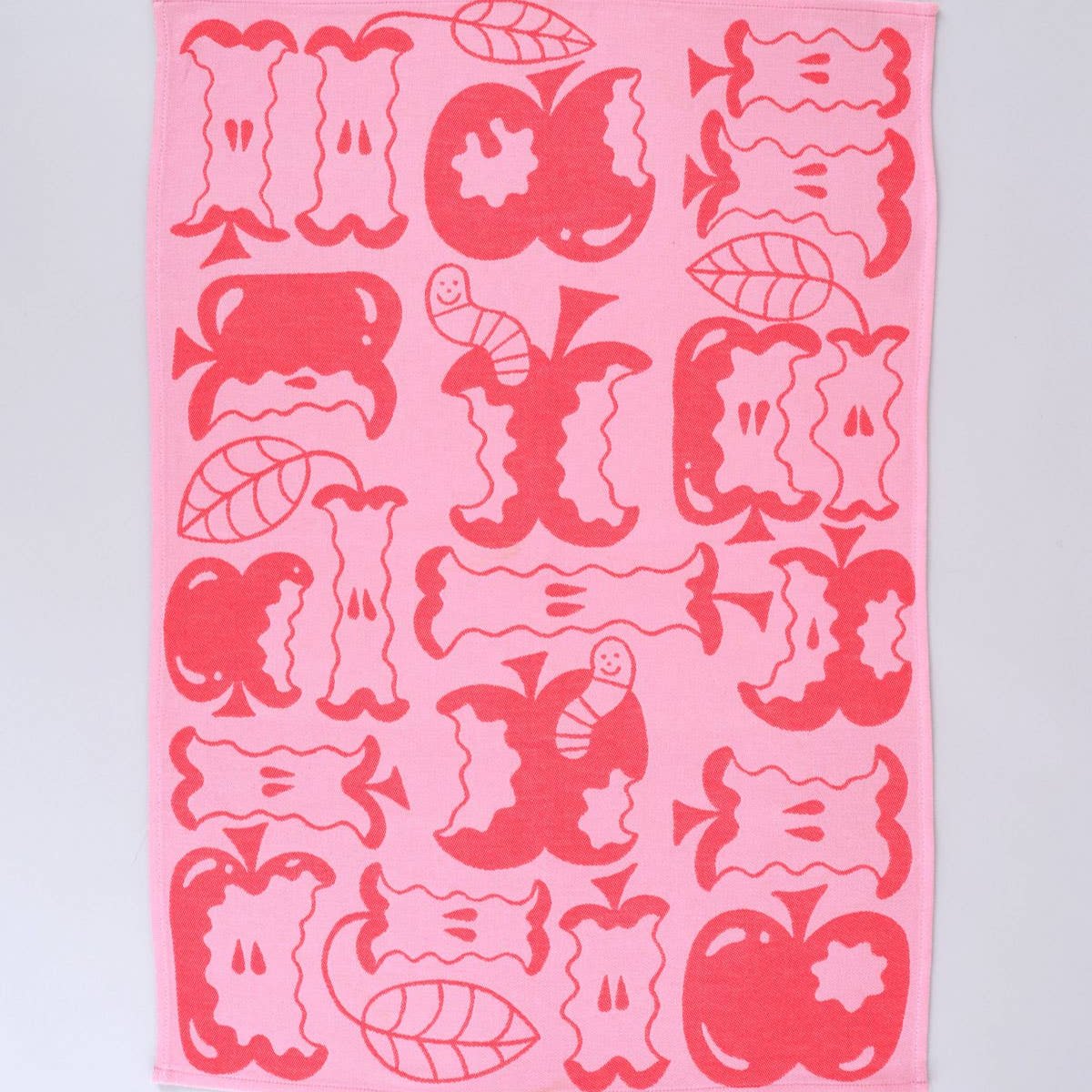 red and pink kitchen towel "an apple a day" shown here in full length