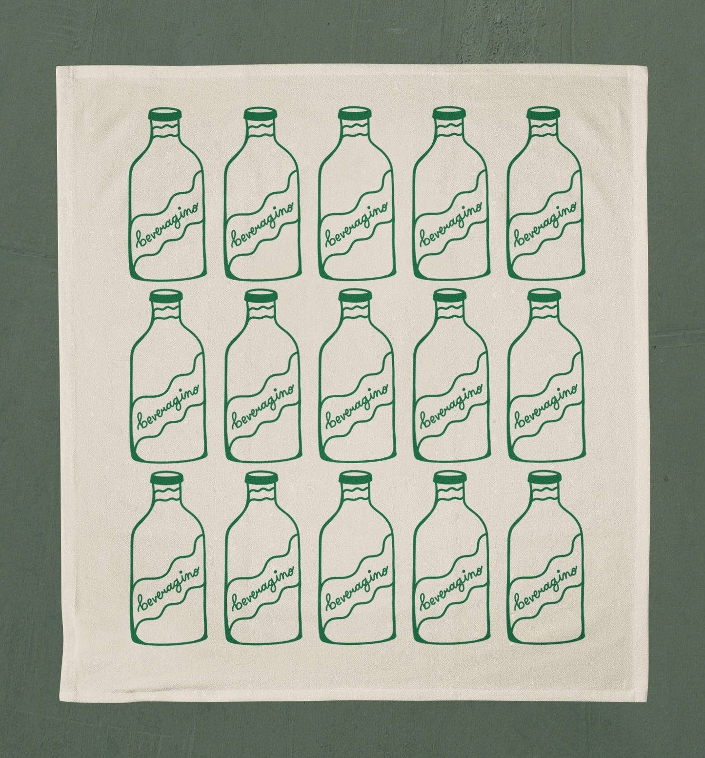 Natural colored tea towel with 3 rows of 5 bottles printed in green ink on it that read "beveragino"
