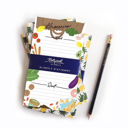 Wants & Needs Grocery notepad -- lined with sections for "wants" and "needs" and has different foods bordering the notepad