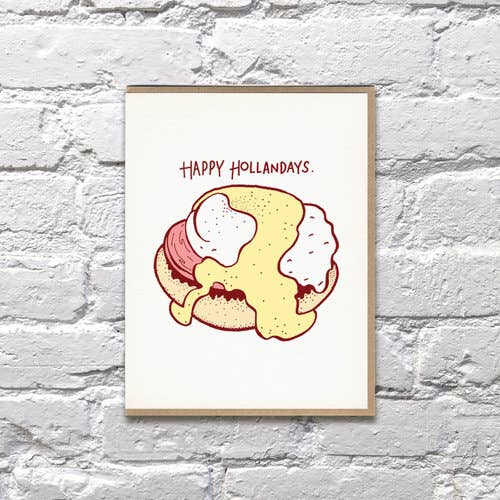 Holiday greeting card with an egg benedict with hollandaise sauce on it. Text reads "Happy Hollandays"