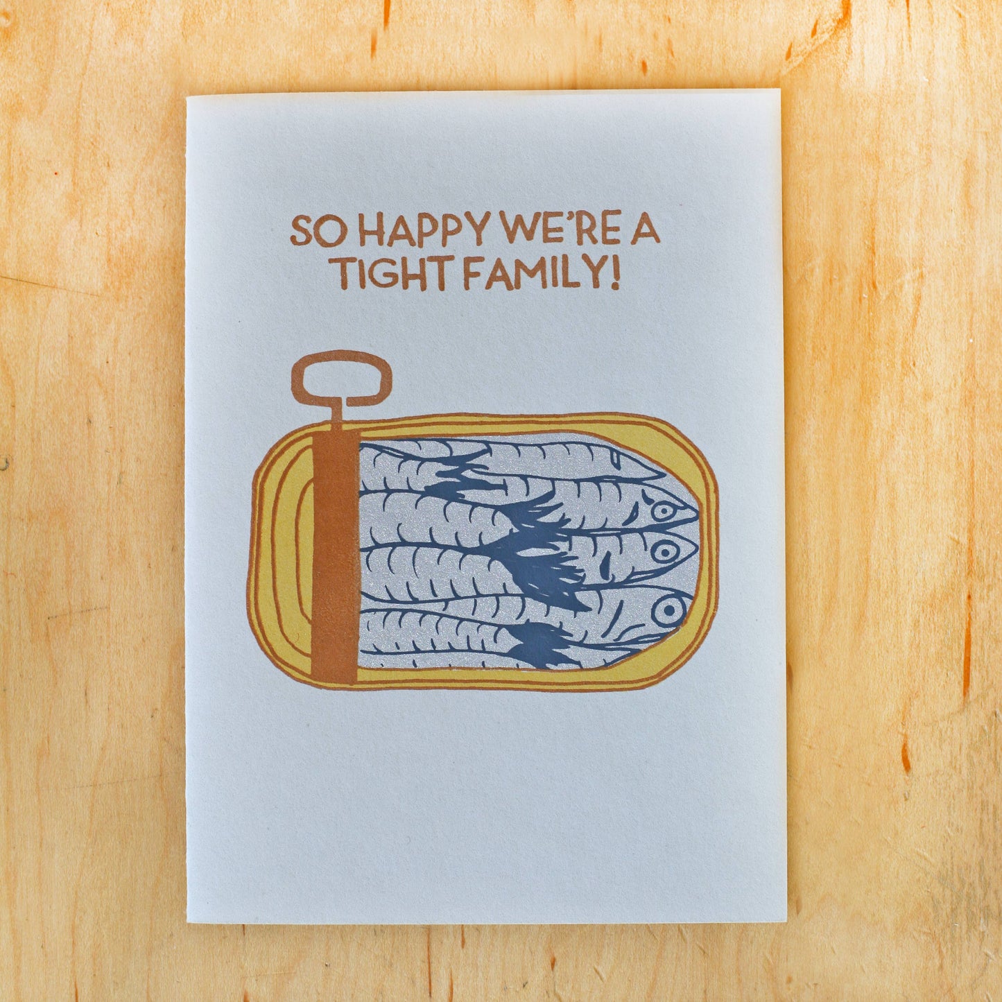 Greeting card with a tin of sardines on it that reads "So happy we're a tight family!"
