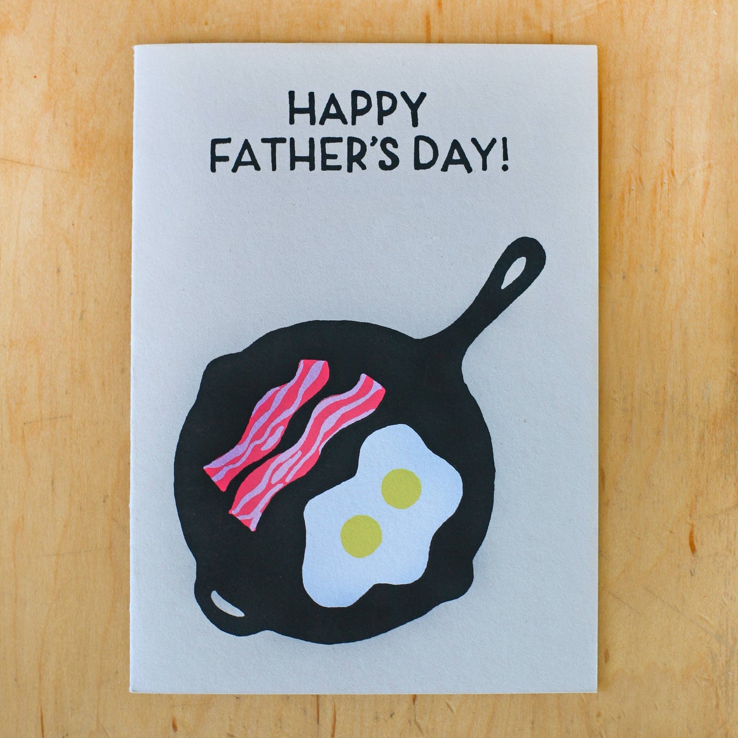 Card reads "Happy Father's Day!" and has illustration of bacon and eggs in a cast iron frying pan
