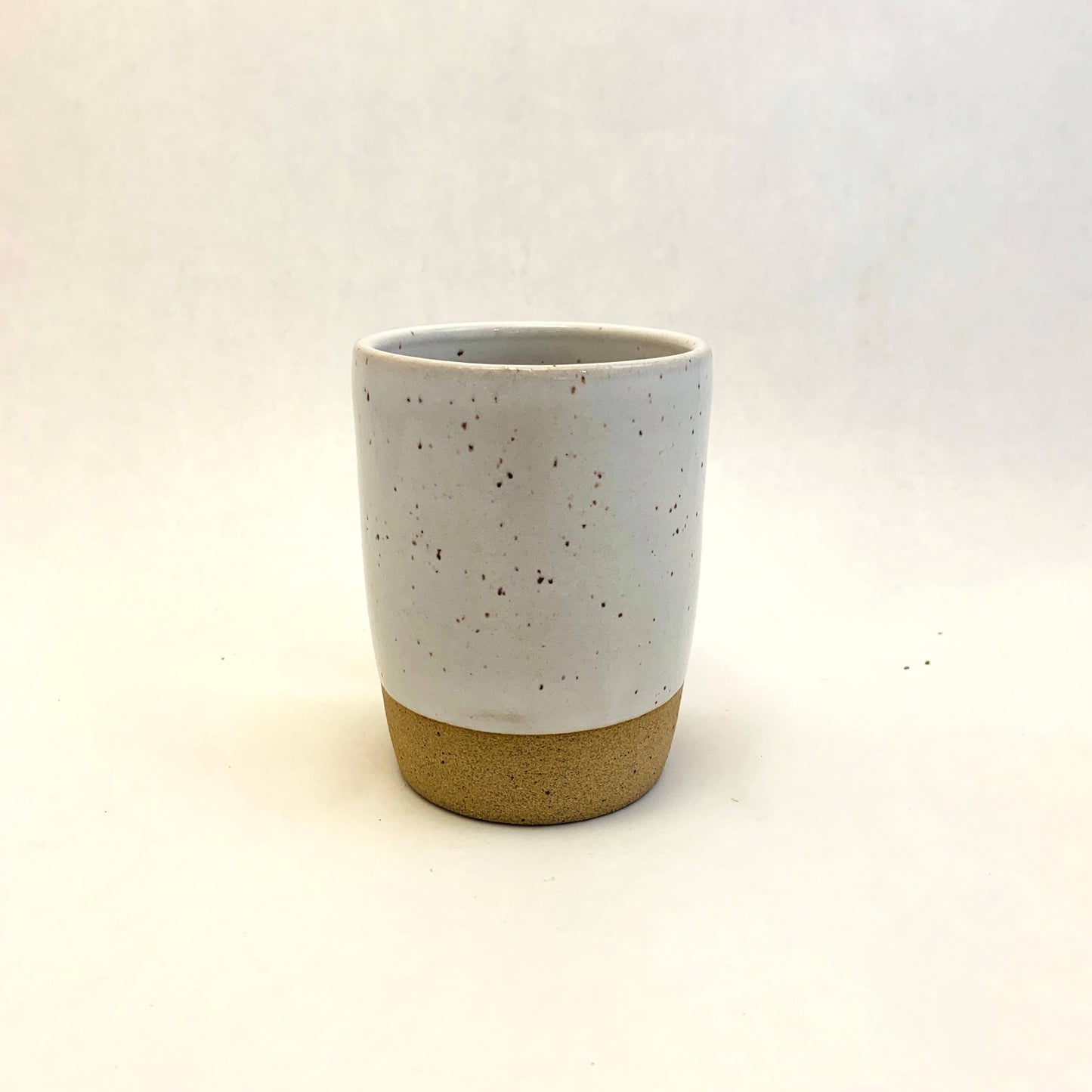 white, ceramic tumbler cup