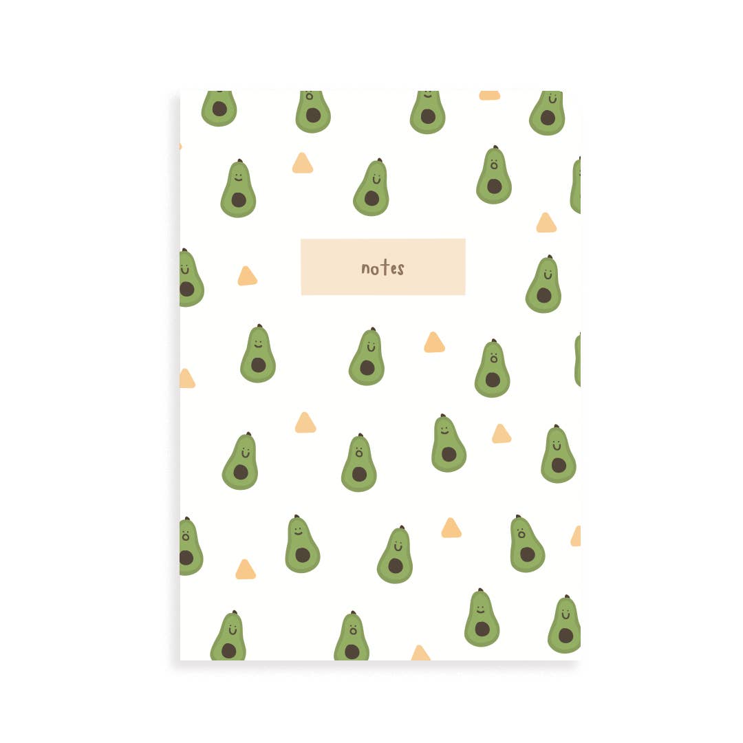 Mini notebook with half avocados and pits with happy faces. Tortilla chips dotted throughtout. There is a rectangle in the center that says "notes"