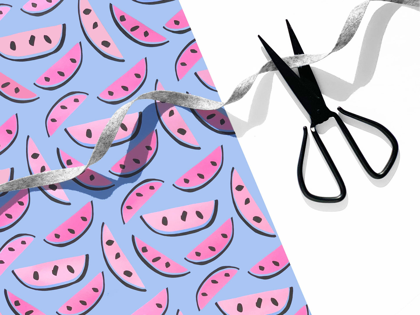 light blue wrapping paer with pink watermelons on it