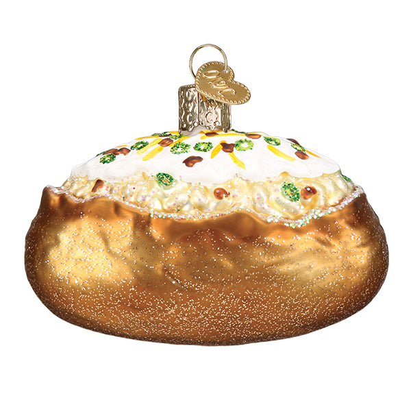 Christmas ornament of a baked potato topped with sour cream, bacon bits, cheese and green onions