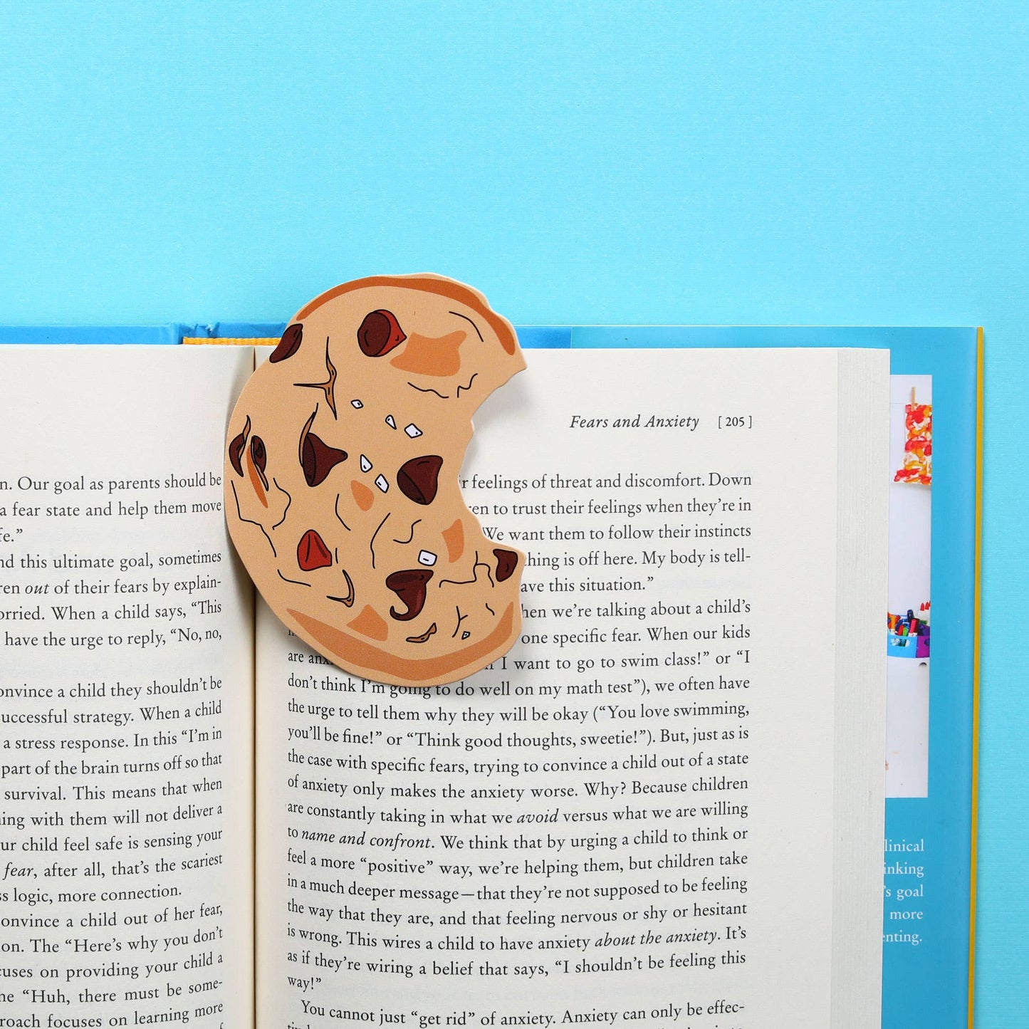 Bookmark made to look like a bitten chocolate chip cookie.