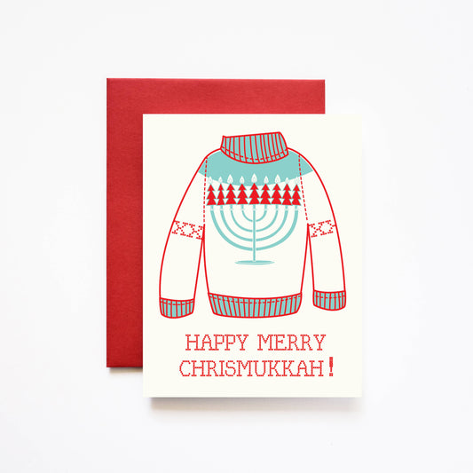 Holiday greeting card that reads "Happy Merry Chrismukkah!" underneath a knit sweater with a menorah on it