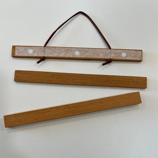 Magnetic wooden frame for posters with string to hang
