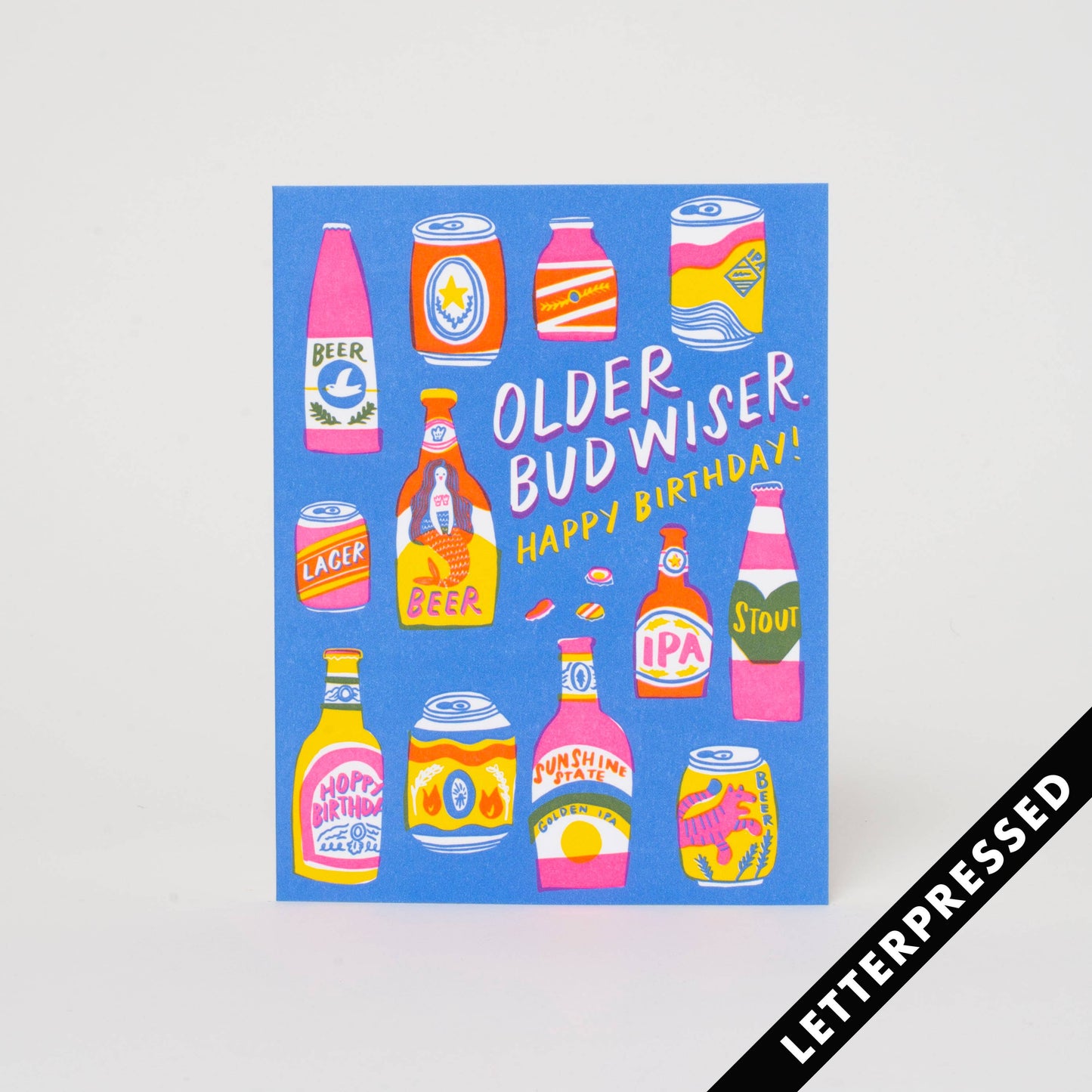 Beer themed birthday card -- blue background with various beer cans and bottles on it. Text reads "Older bud wiser. Happy Birthday!"