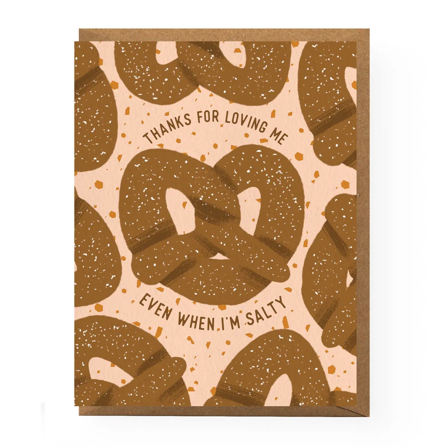 Greeting card with pretzels on a mostly pink background with pretzel crumbs for the design. In the center it reads "Thanks for loving me even when I'm salty" Comes with brown kraft envelope.