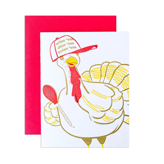 Thanksgiving Turker greeting card -- turkey is wearing a cap that says "Wine 'em Dine 'em Brine 'em"