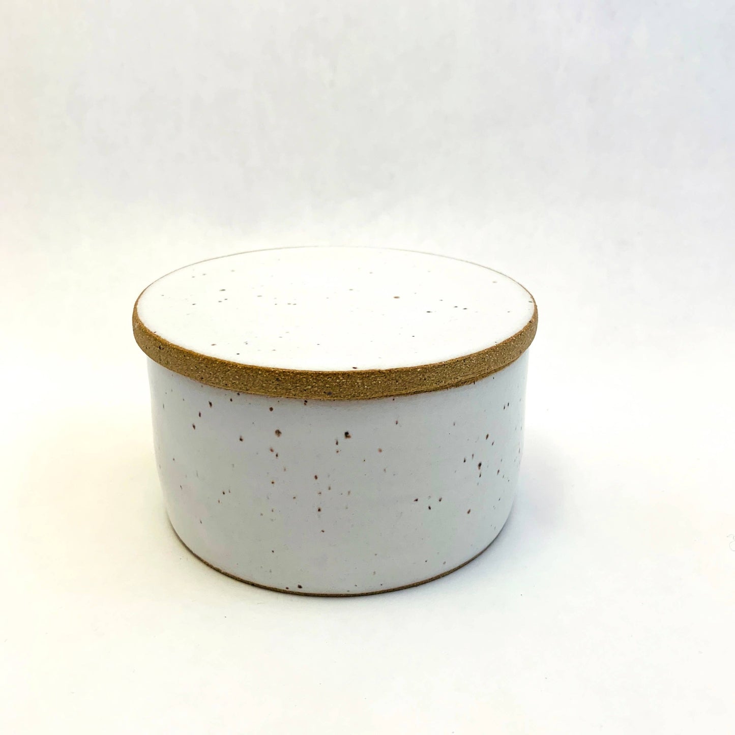 white ceramic butter keeper