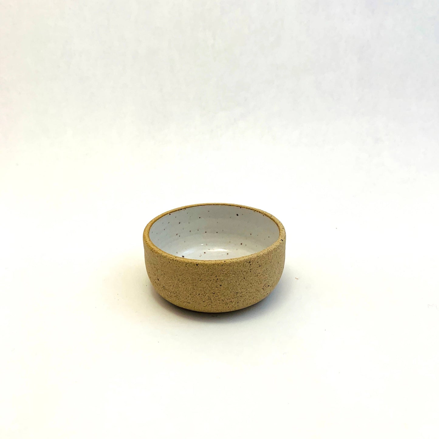 mini ceramic bowl -- glazed white inside and left unglazed outside