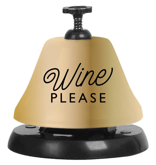 Gold and black call bell that reads "Wine please" 