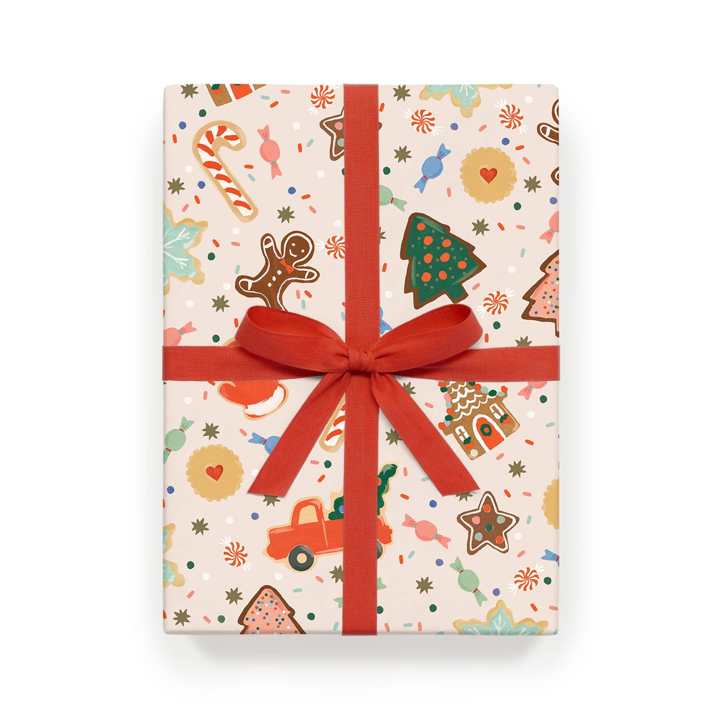 Wrapping paper sheet featuring illustration of Christmas cookies in assorted shapes - gingerbread people, candy canes, vintage truck with Christmas tree, etc. Shown with a big red ribbon.