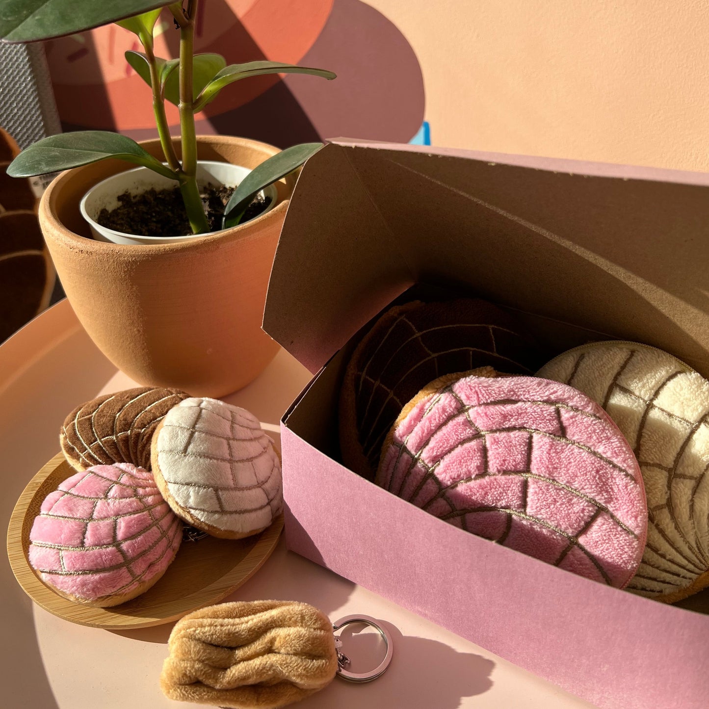 Concha plush key chain in pink, brown and white