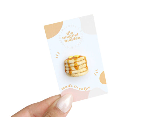 Handmade magnet shaped like stack of five pancakes with syrup and butter on top. 
