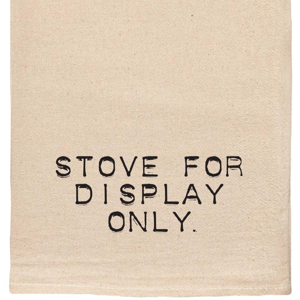Natural colored tea towel that reads "stove for display only"