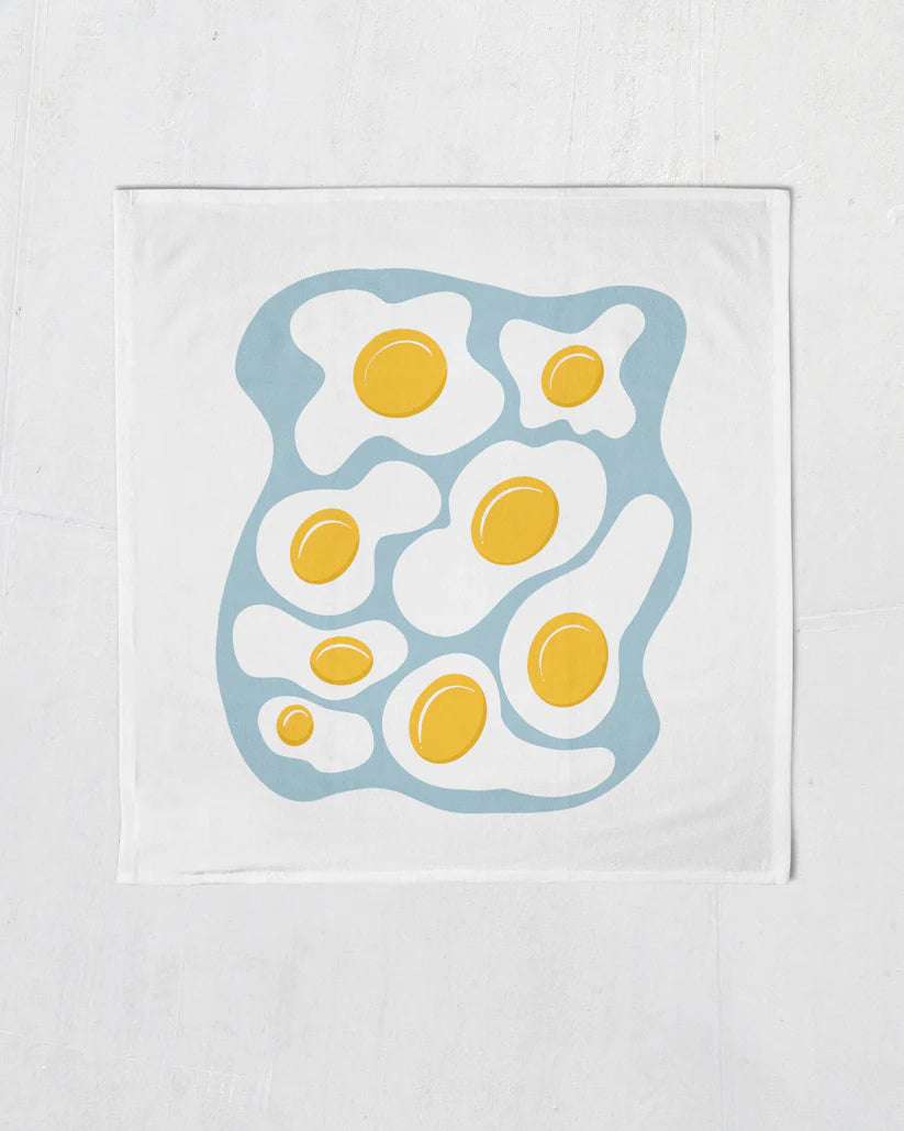 fried eggs tea or kitchen towel