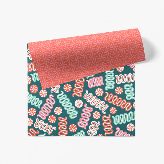 Doublesided holiday wrapping paper  -- various hard candy on one side and red and pink pinwheels on the other
