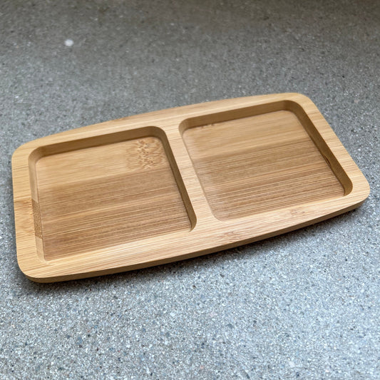 Wooden tray with two side by side, separated compartments.
