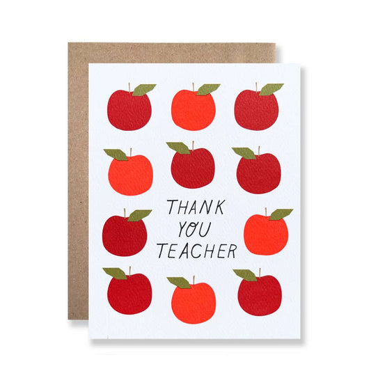 Greeting card with apples all over. Text in center reads "Thank you teacher" 