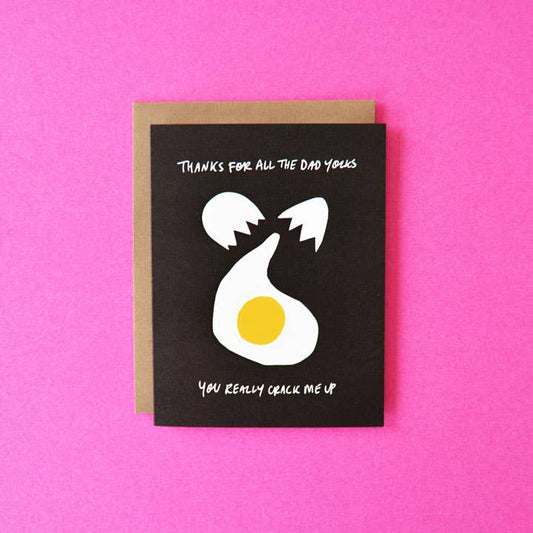 Father's day greeting card with an egg being cracked on it with text that reads "Thanks for all your dad yolks. You really crack me up" 