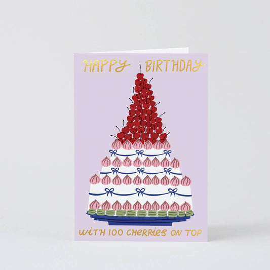 Birthday card with a cake illustration and cherry details on a white background