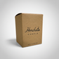 Brown cardboard box with 'Horchata Candle' text on a light gray background