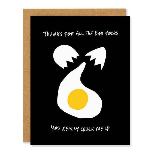 Black greeting card with an egg being cracked on it. Text reads "Thanks for all the dad yolks. You really crack me up" 