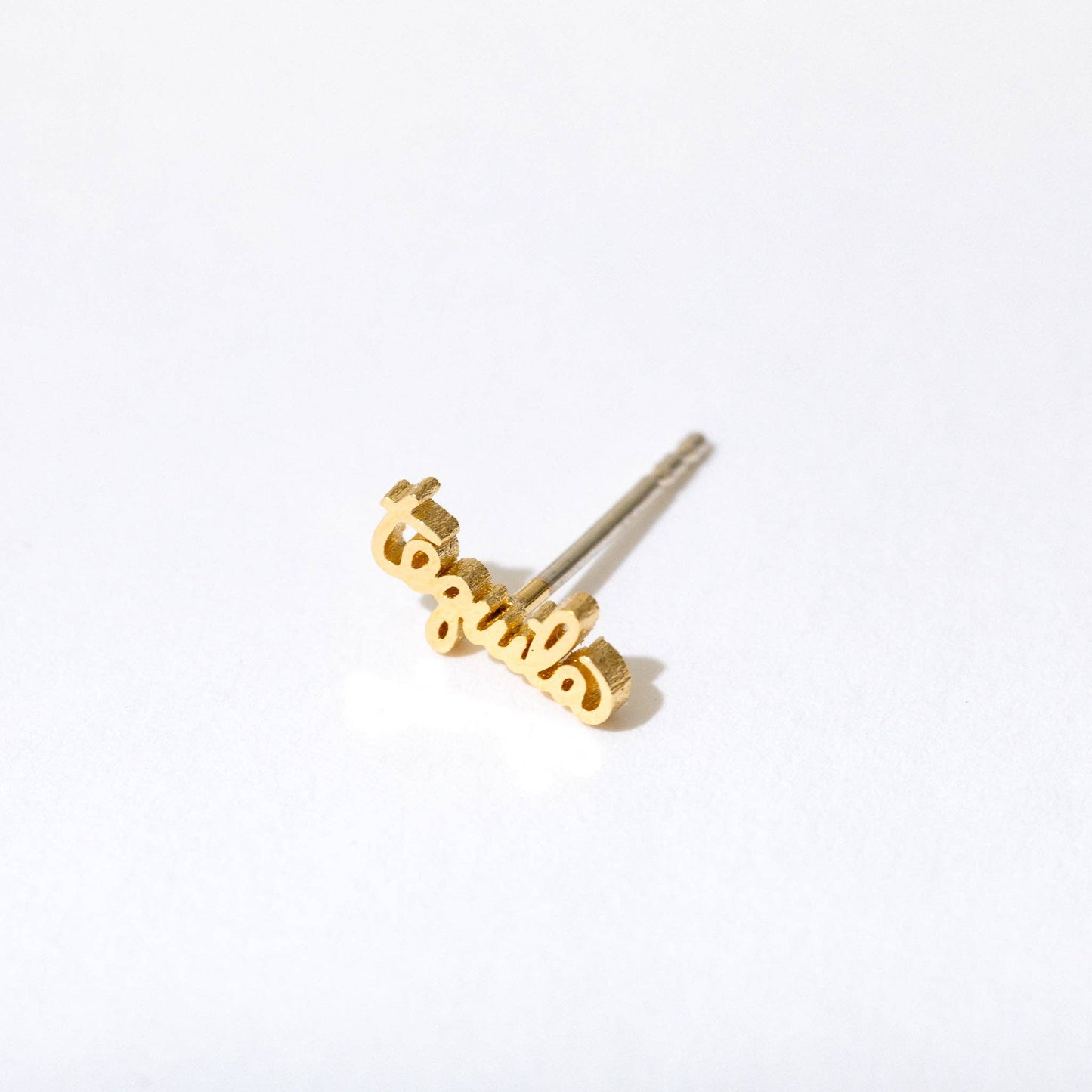 Single stud earring -- 14k gold plated text in script writing that reads "tequila" 
