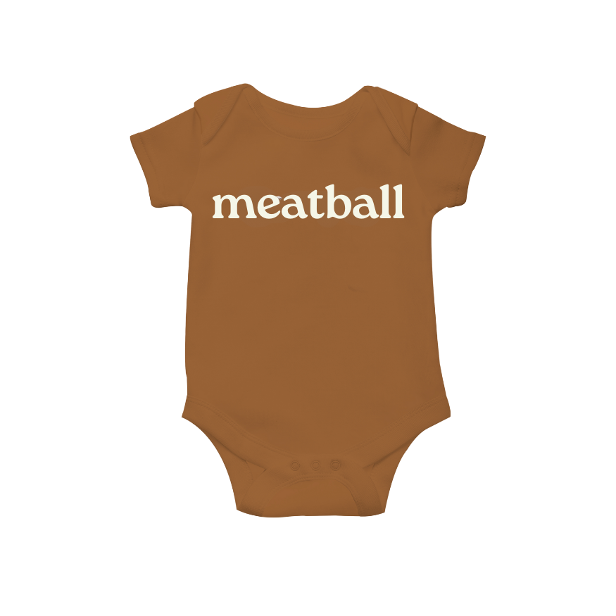 Brown baby onesie with 'meatball' printed on a white background
