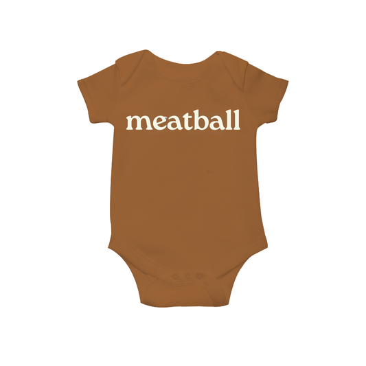 Brown baby onesie with 'meatball' printed on a white background