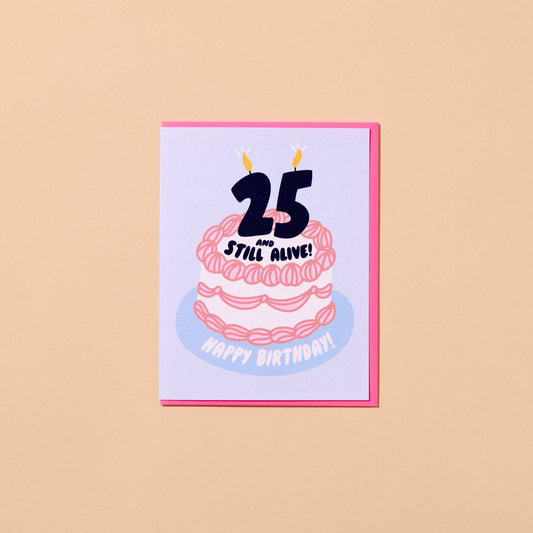 Birthday card with a cake illustration and text that reads "25 and still alive! Happy birthday!" on a beige background