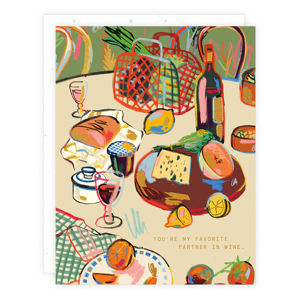 Greeting card with illustration of a table with a bottle of wine, glasses, bread, cheese and lemons among other things. Text reads "You're my favorite partner in wine." 