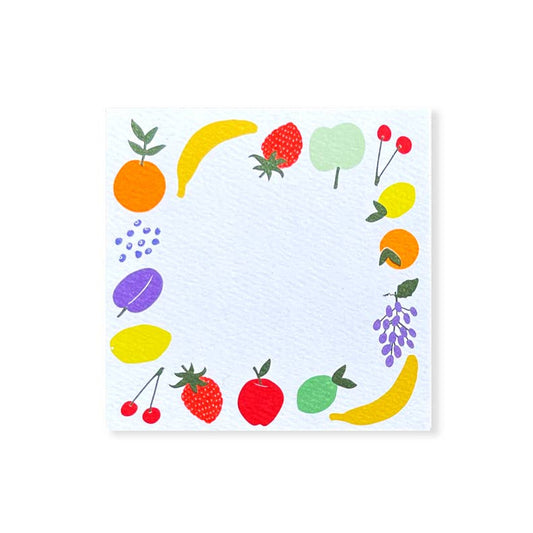Blank notecard with various, brightly colored fruit decorating the edges 