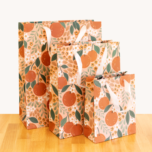Gift bag with oranges and flowers as the design -- shownn here are all three sizes: Large, small and extra small 