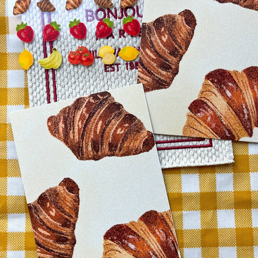 Sticker sheet with included post card of croissants