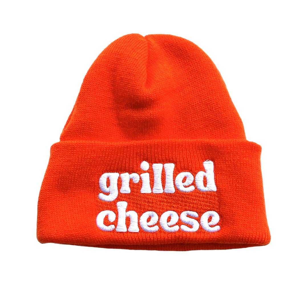 Orange beanie with white embroidered text that reads "grilled cheese"