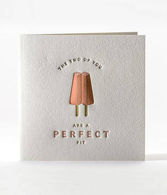Greeting card with twin strawberry popsicles and text that reads "The two of you are a perfect fit" 