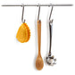 Mezzelune pot holder hanging on s-hook with wooden spoon and pasta spoon 