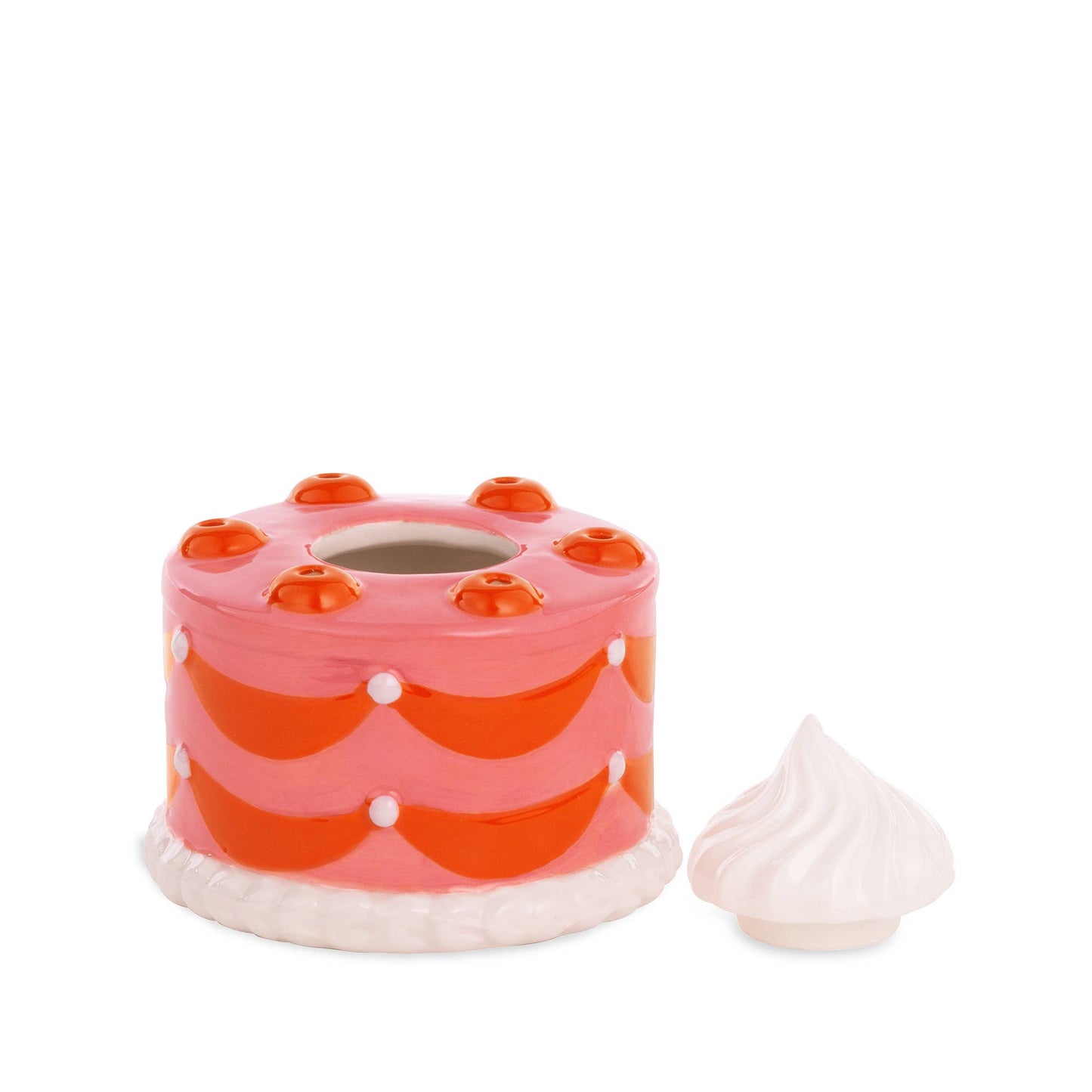 Ceramic cake match holder and striker --shaped like a whole, round cake and painted red and pink. Has a dollop of whipped cream on top that is a removable lid, covering space to house matches 